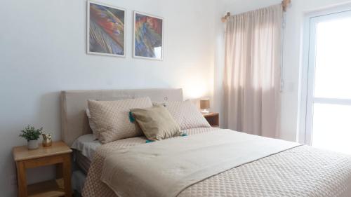 Postel nebo postele na pokoji v ubytování Apartamentos Tzapotitlan