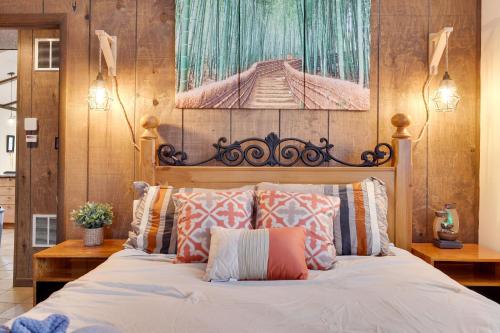 a bedroom with a large bed with pillows at Woodland Escape-0.6Mile to Lake Beach Pet Friendly in Lake Harmony
