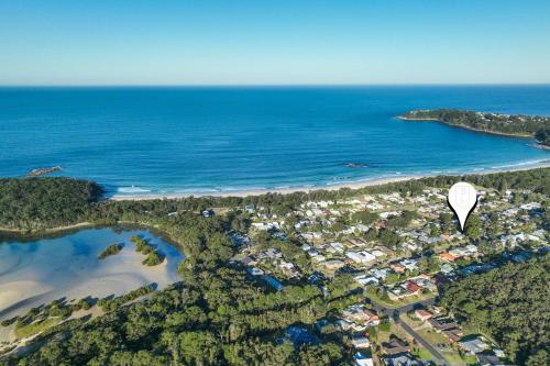 an aerial view of a beach with a hot air balloon at Birdsea House in Narrawallee