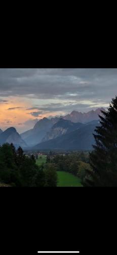 a view of a valley with mountains in the distance at Wengerwirt zur Laube Komfortzimmer Deluxe in Weng im Gesäuse