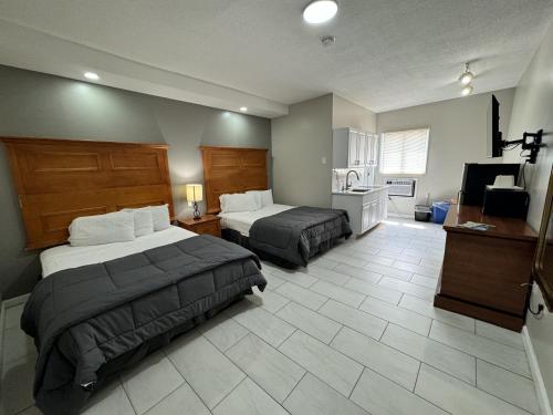 Postel nebo postele na pokoji v ubytování Paradise Inn