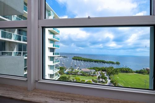 a window view of the ocean from a condo at Hotel Arya BW Premier Collection in Miami