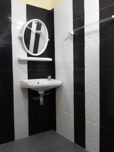 a bathroom with a sink and a mirror on the wall at No.17 @ Khaoyai in Mu Si