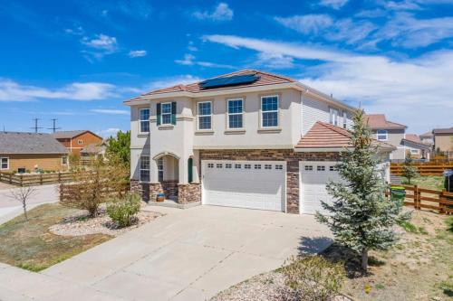 a white house with a garage at 4BR Hot Tub Pool Table, Ping Pong, Foosball! in Peyton