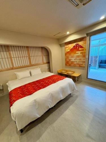 Postel nebo postele na pokoji v ubytování Hotel Be-zen shimanouchi