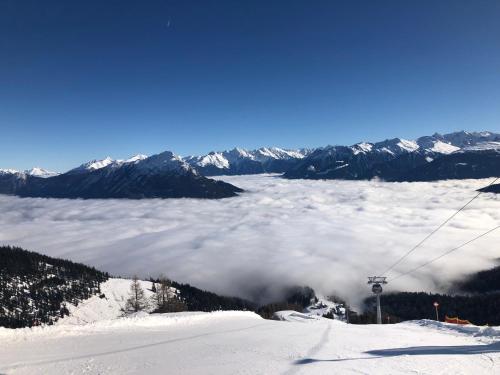 a view from a ski lift above a layer of clouds at FLATS 2 RENT in Imst