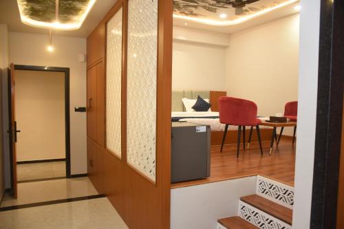 a hallway with a door leading to a bedroom at Hotel Pride Of Chittor in Chittaurgarh