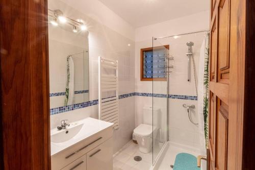 a bathroom with a sink toilet and a shower at Cliff View Terrace By Dream Homes Tenerife in Puerto de Santiago