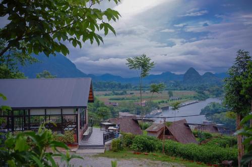 a house with a view of a river and mountains at Fuang Dao Mountain Resort in Muang Fuang