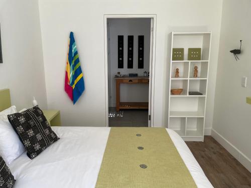 a bedroom with a bed and a desk in it at Home of Synergy in Johannesburg