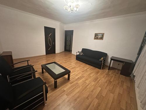 a living room with a couch and a table at Ori Villa in Likani