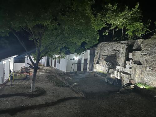 a stone building with a tree in front of it at Ori Villa in Likani