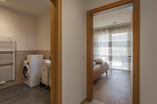 a living room with a washer and dryer at Residence Weinberg 8 in Nalles