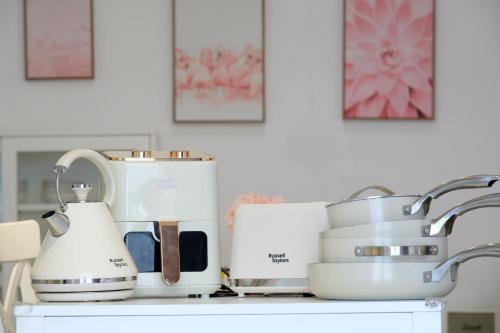 a kitchen counter with appliances on it at Comfy Cafe 43 Homestay- Holiday Home in Tanah Rata