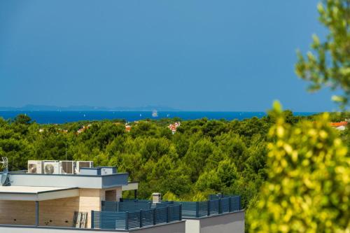 a view of a building with trees in the background at Luxury Penthouse ARIA in Zadar