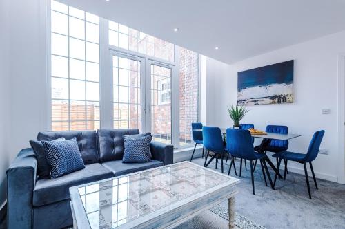 a living room with a couch and a table and chairs at Middleton Chambers by Guestz in Hull