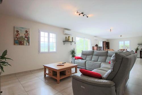 a living room with a couch and a coffee table at Hergarai in Saint-Jean-le-Vieux