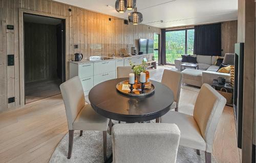 a kitchen and dining room with a table and chairs at Amazing Apartment In Hemsedal With Wifi in Hemsedal