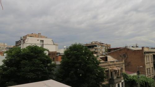 a view of a city with buildings and trees at Loka Chovelidze in Tbilisi City