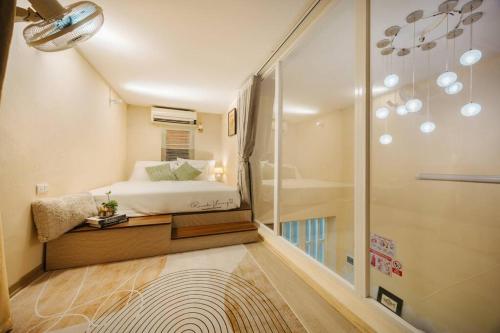 a small bedroom with a bed and a shower at 6pax Full house 100m to Train street Heart of Old Quarter in Hanoi