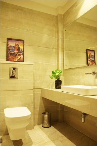 a bathroom with a toilet and a sink at TreeHouse London Street Amritsar in Amritsar