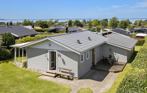 an aerial view of a small house with a patio at 3 Bedroom Lovely Home In Bogense in Bogense