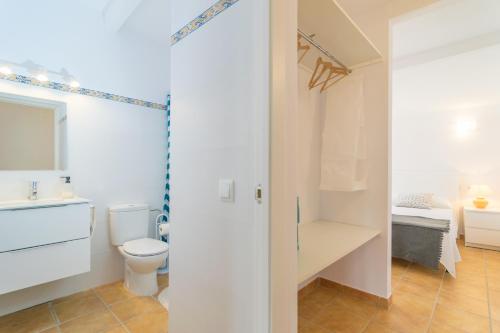 a bathroom with a toilet and a sink at Ses Canyes in Muro