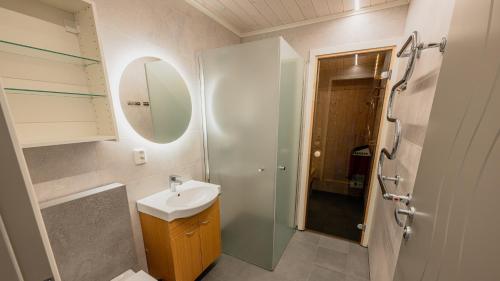 a bathroom with a sink and a shower at Lakeview II Vrådal Hyttegrend in Vradal