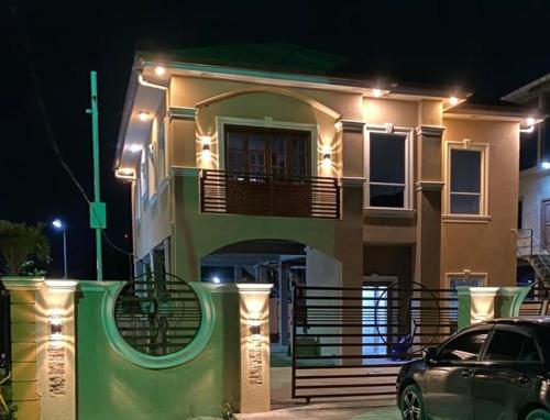 a car parked in front of a house at night at The Royal Haven Herstelling GY in Nismes