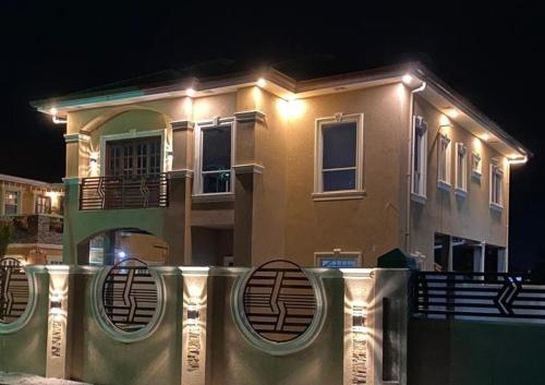 a house with lights on top of it at night at The Royal Haven Herstelling GY in Nismes
