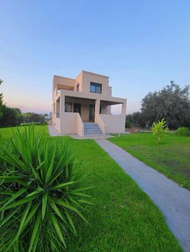 a small house with a pathway in front of it at Villa Coppa in (( Kermetés ))