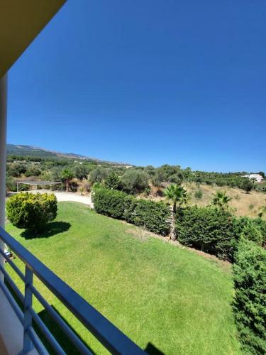 a view of a yard with a fence and grass at Villa Coppa in (( Kermetés ))