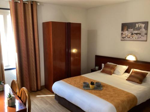 Postel nebo postele na pokoji v ubytování Hôtel Angelic