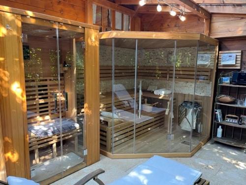 a large room with glass doors with beds in it at AP-RANCH Ferienzimmer Sternenblick in Lochen