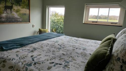 Ένα ή περισσότερα κρεβάτια σε δωμάτιο στο Bed and Breakfast Hammerhoeve