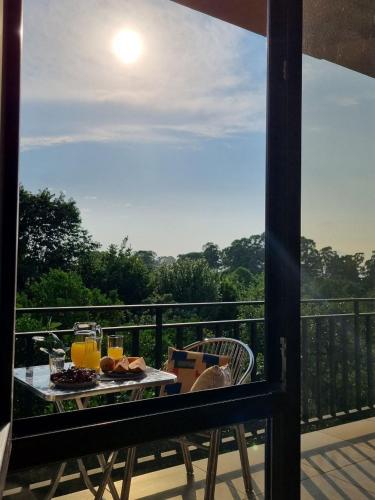 a plate of food on a table on a balcony at Lazare in Batumi