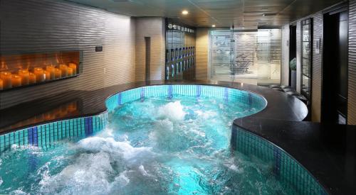a hot tub in a hotel with water in it at Four Points by Sheraton Lahore in Lahore