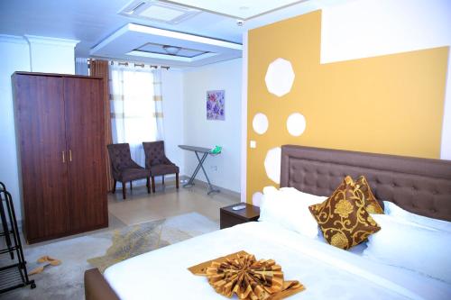 a bedroom with a bed with a bow on it at IZA Serene city centre apartments in Kigali