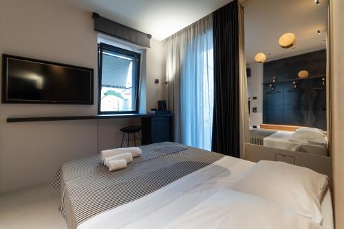 En eller flere senge i et værelse på B&B Flow