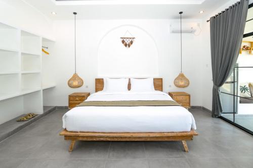 Katil atau katil-katil dalam bilik di Pradnya Villa by Prasi