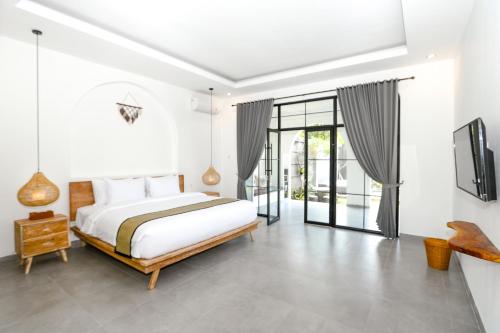 Katil atau katil-katil dalam bilik di Pradnya Villa by Prasi