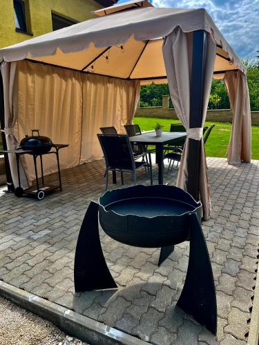 a large tent with a table and chairs under it at HARMONY Apartments in Rajecké Teplice