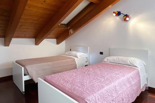 Postel nebo postele na pokoji v ubytování Dreams on the Lake - Affitti Brevi Italia