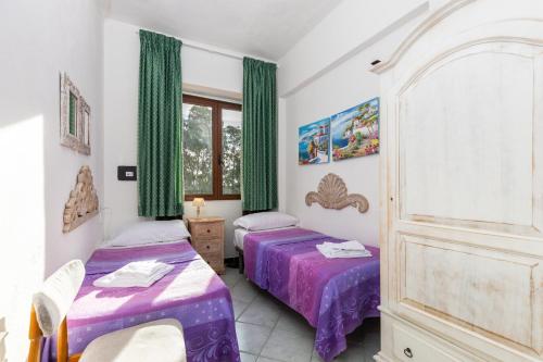 Postel nebo postele na pokoji v ubytování Helios Hotel