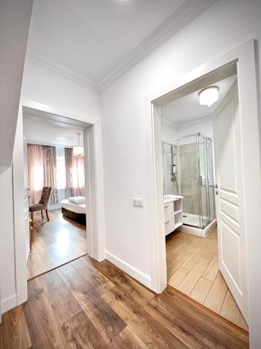 an empty room with a bathroom and a bedroom at Armonia Apartments in Timişoara
