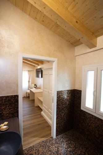 a room with a door leading to a bathroom at Dal Doge - Guest House in Chioggia
