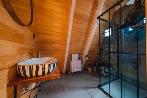 a bathroom with a sink and a glass shower at KAYA PALACE SAPANCA in Sapanca