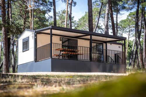 a rendering of a tiny house in the woods at Camping Urbion in Abejar