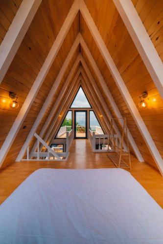 a large attic room with a large wooden ceiling at KAYA PALACE SAPANCA in Sapanca