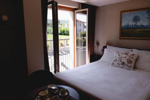 Postel nebo postele na pokoji v ubytování Ayma B&B